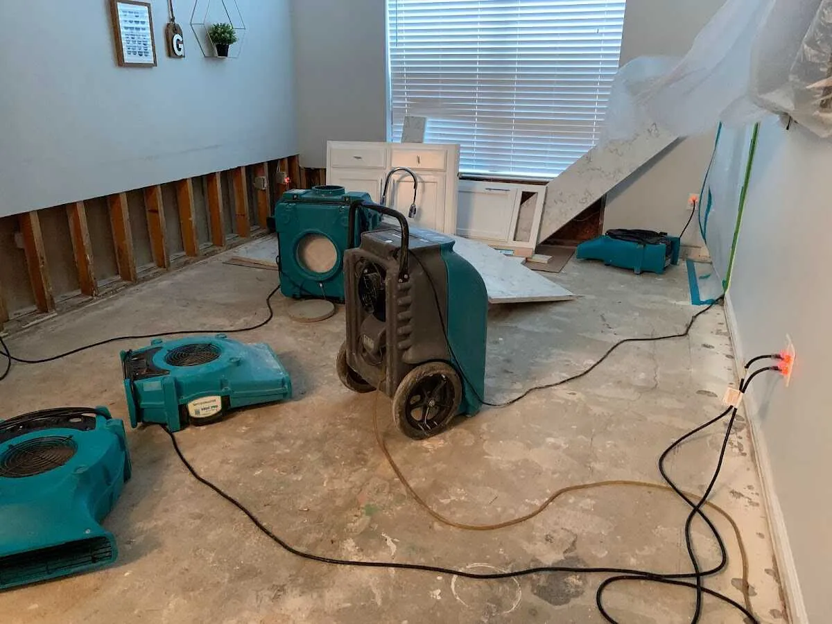 Dehumidifier in flood-cut room for Water Damage Restoration in Magna